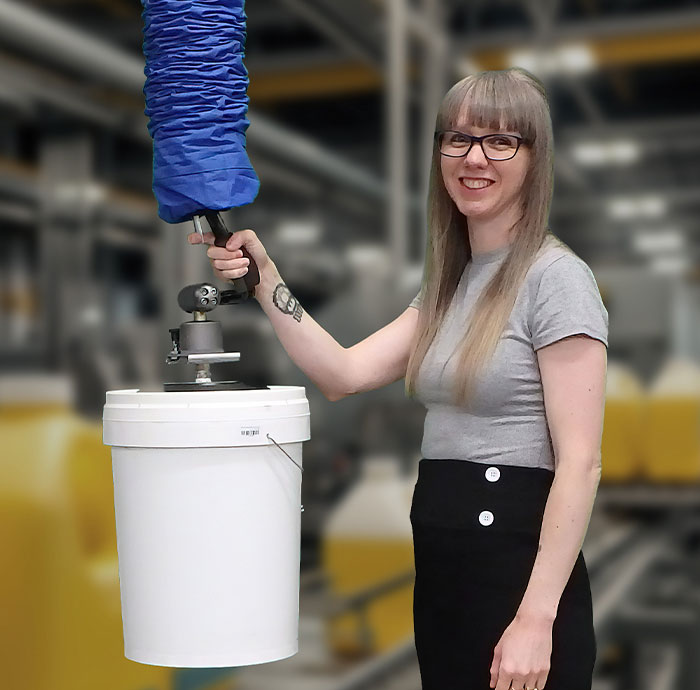 Compact vacuum lifter in use lifting a plastic pail